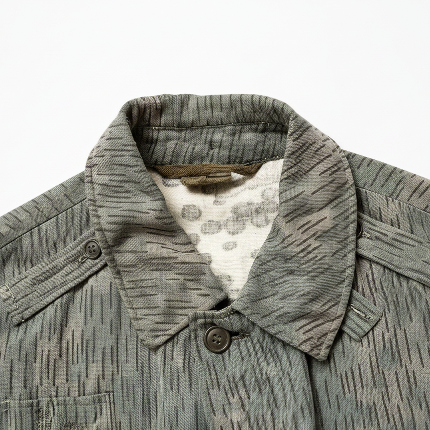 Close-up of a green jacket with a patterned collar on a white background