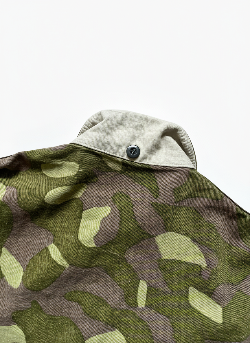 Camouflage-patterned fabric on a white background